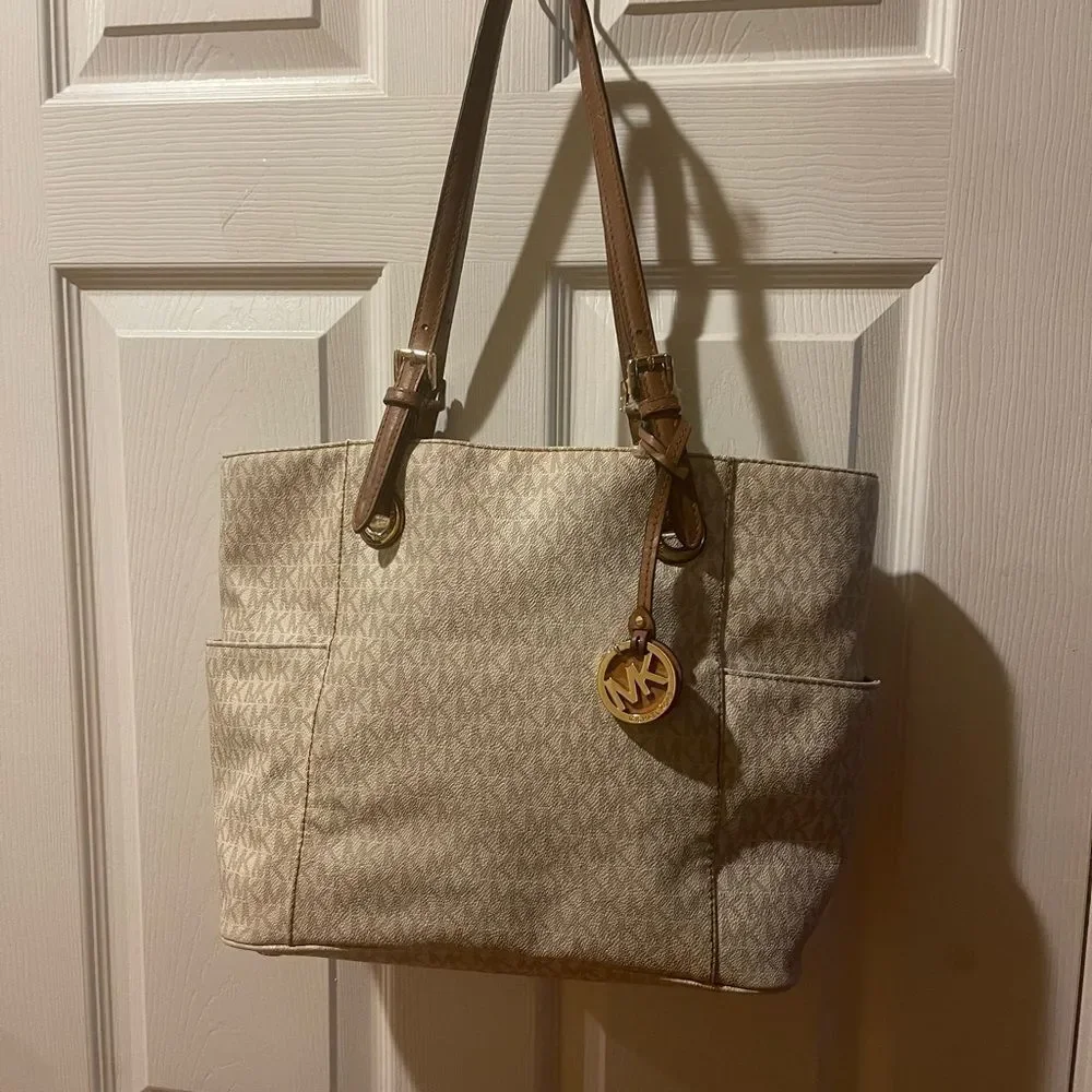 Michael Kors Beige signature Coated Canvas tote , tan leather straps .